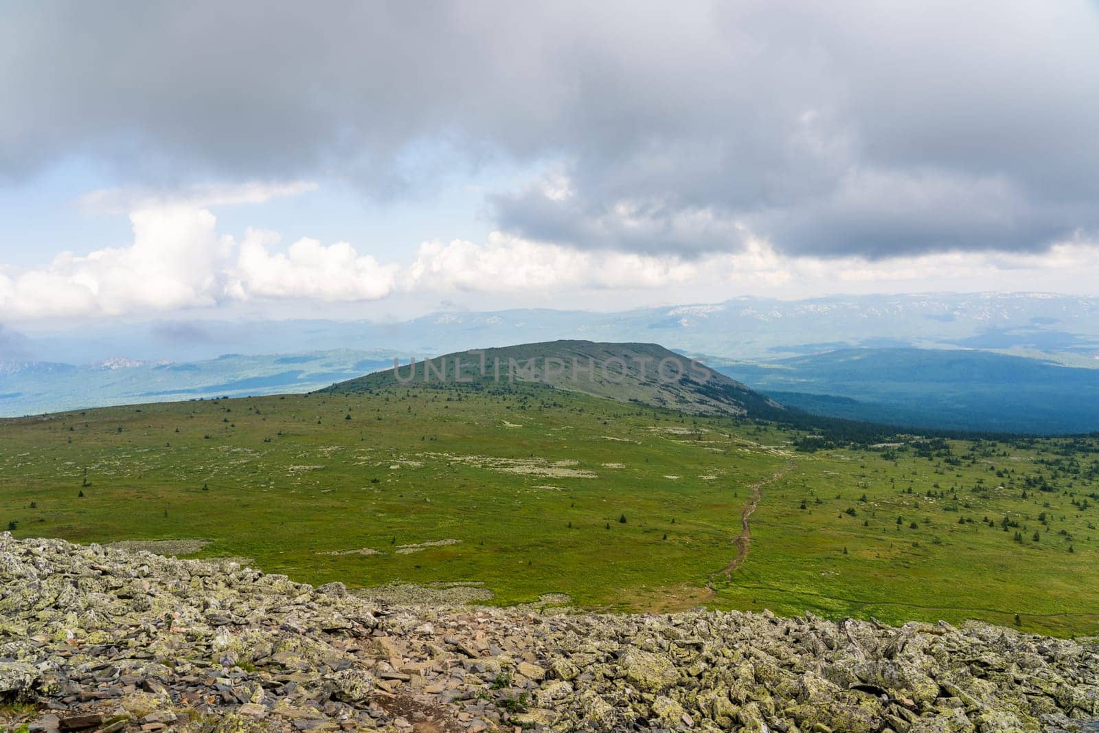 Forests and mountains of the Southern Urals near the village of Tyulyuk in Russia. Drone view