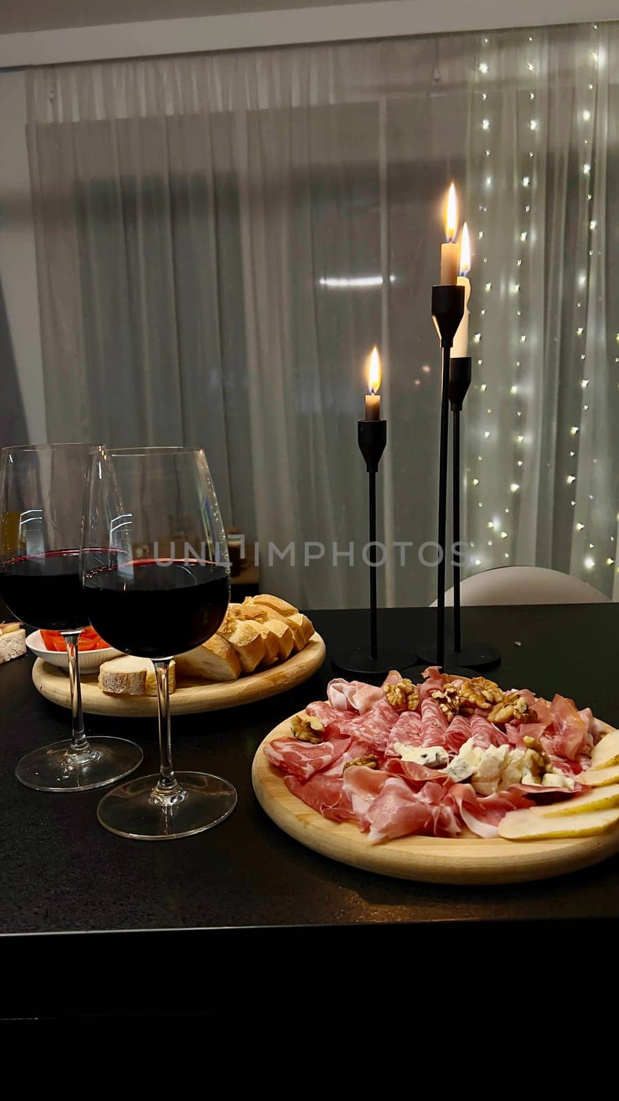 Festive candlelight dinner with shrimp and caviar sandwiches. High quality photo