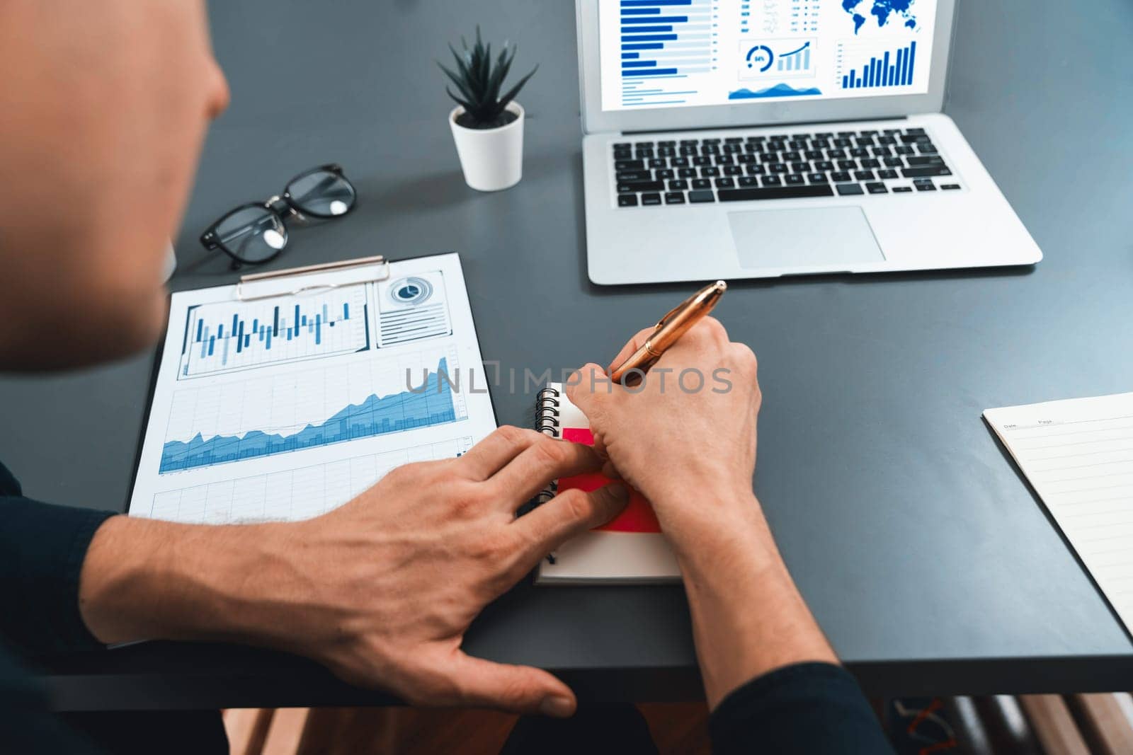 Group of diverse office worker employee take note and brainstorming on strategic business marketing planning with sticky note in office workspace. Positive and productive teamwork in workplace.Prudent