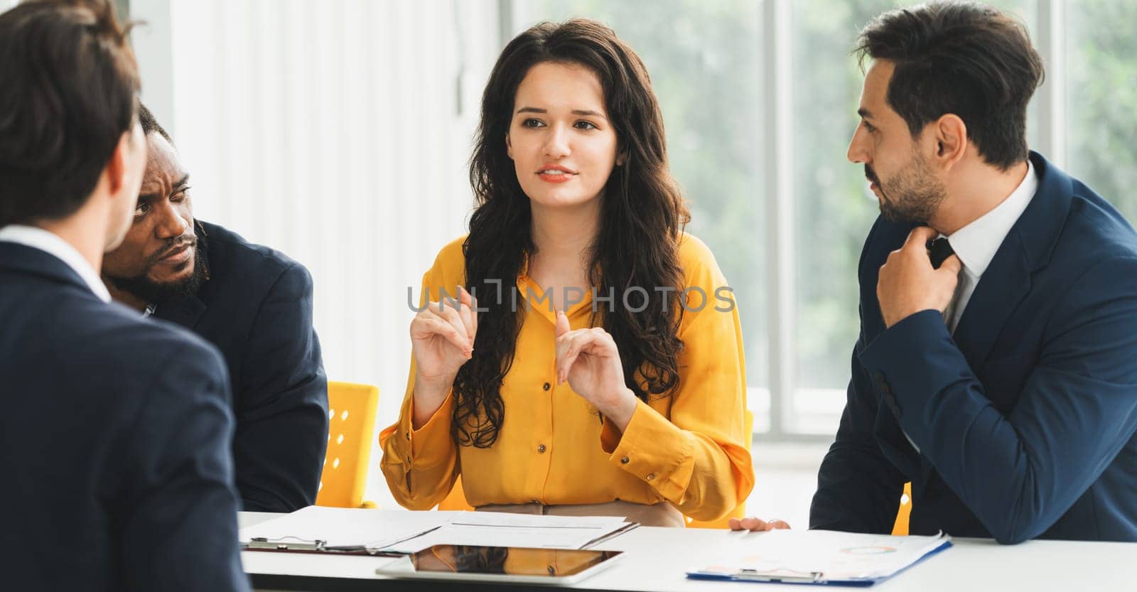 Diversity recruiters interview candidate at the bright office. A group of human resources professionals explaining an applicant for a new position. asking interviewee a question. Intellectual.