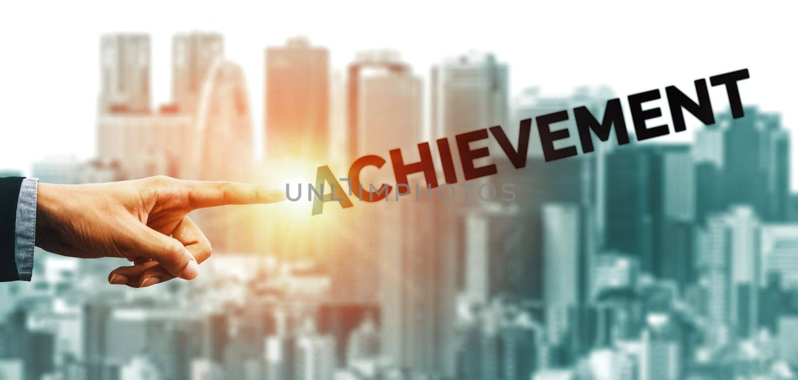 Creative business people hand pointing at word. Concept image of achievement and goal success. uds
