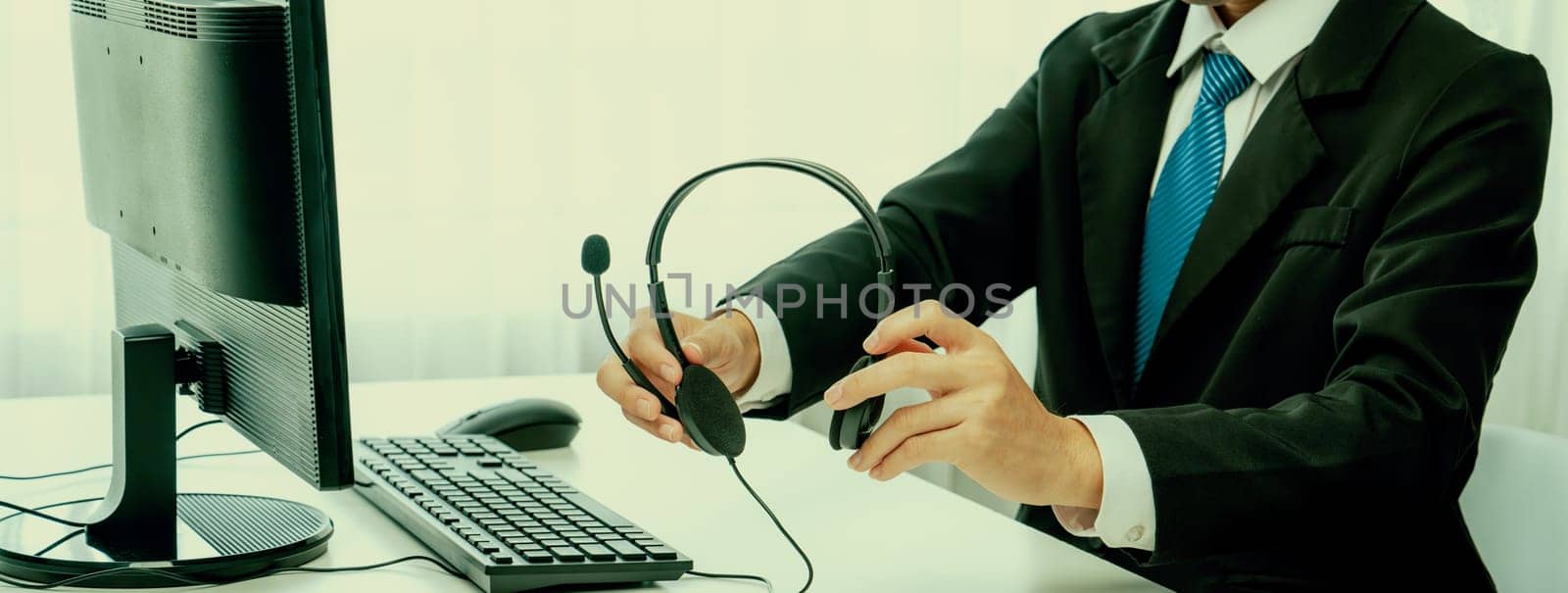 Business people wearing headset working in office to support remote customer or colleague. Call center, telemarketing, customer support agent provide service on telephone video conference oratory call