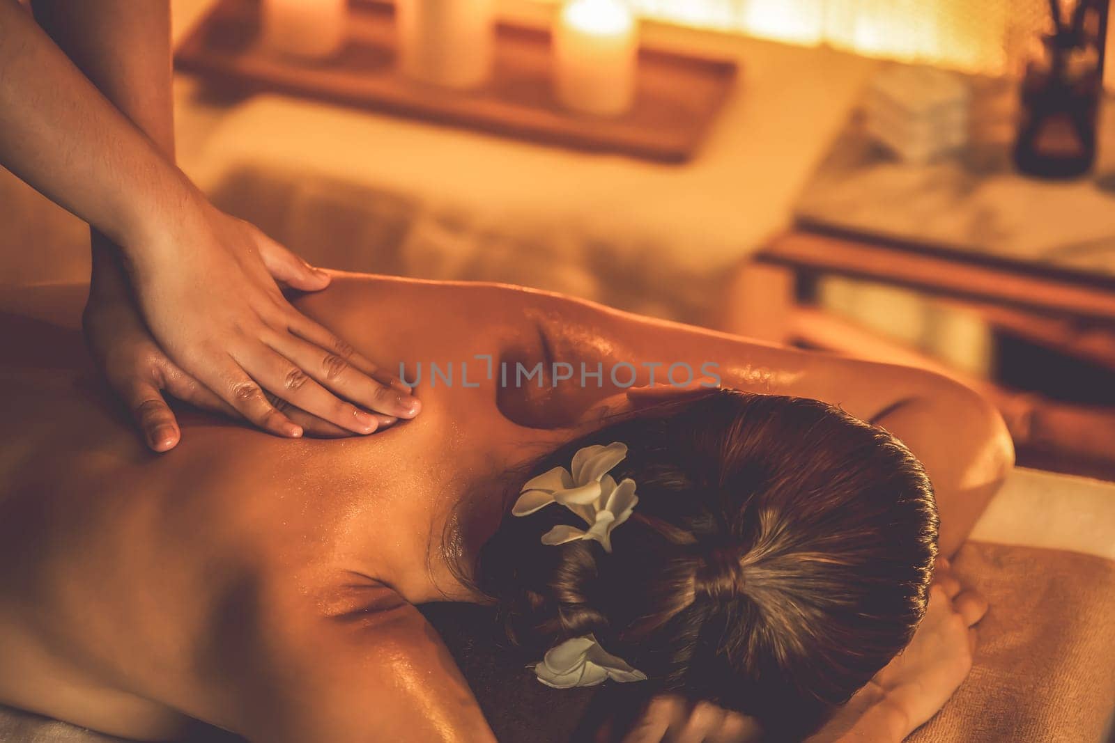 Caucasian woman customer enjoying relaxing anti-stress massage. Quiescent by biancoblue