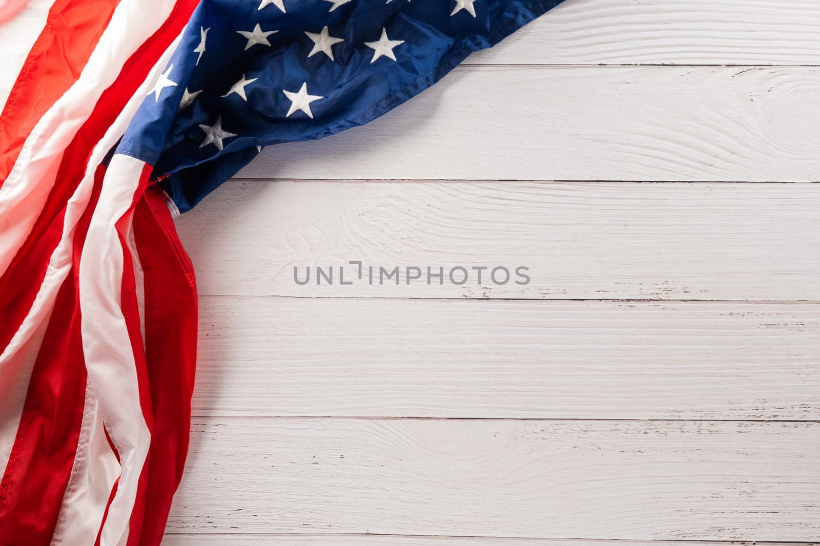 USA flag for Memorial day on abstract white wood background by Sorapop