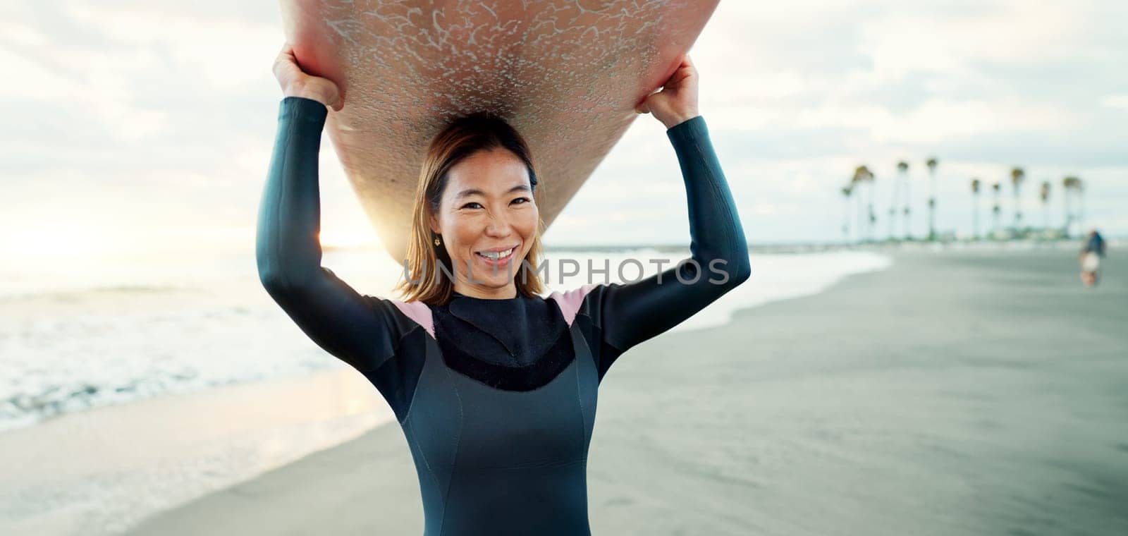 Surfing, beach and portrait of woman with surfboard for water sports, fitness and freedom by tropical ocean. Nature, travel and happy Japanese person on sand on holiday, vacation and adventure by sea by YuriArcurs