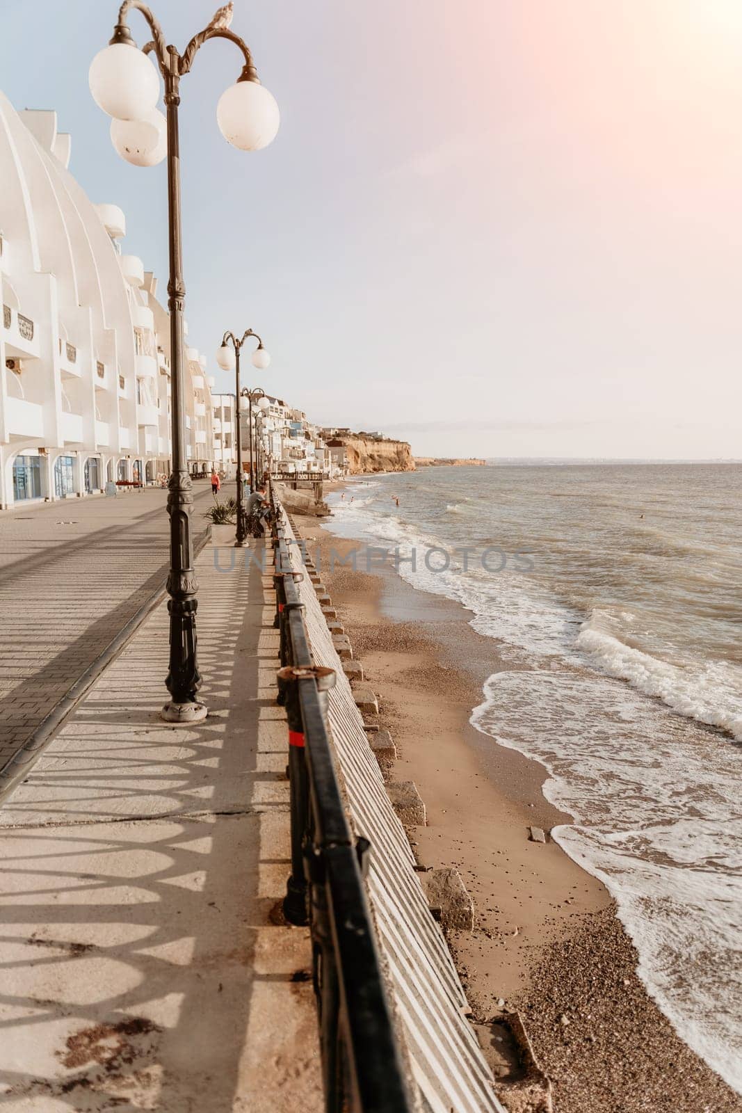 Coastal residential areas with a modern hotel and restaurant complex alongside sandy beaches. Summer holiday vacation and travel concept. by panophotograph