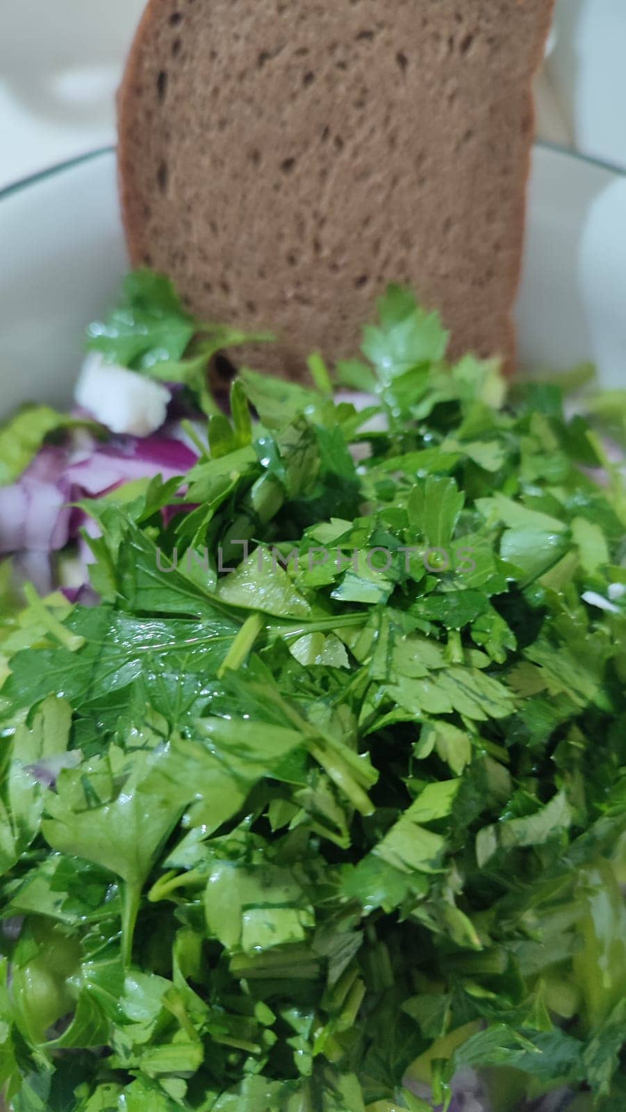 fresh green parsley salad, red onion, cheese, kitchen board, food, vegetarianism. High quality photo