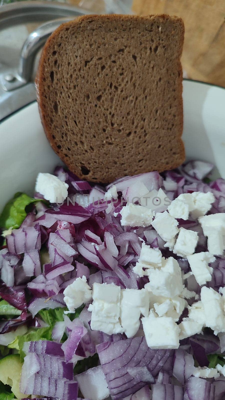 fresh green parsley salad, red onion, cheese, kitchen board, food, vegetarianism. High quality photo