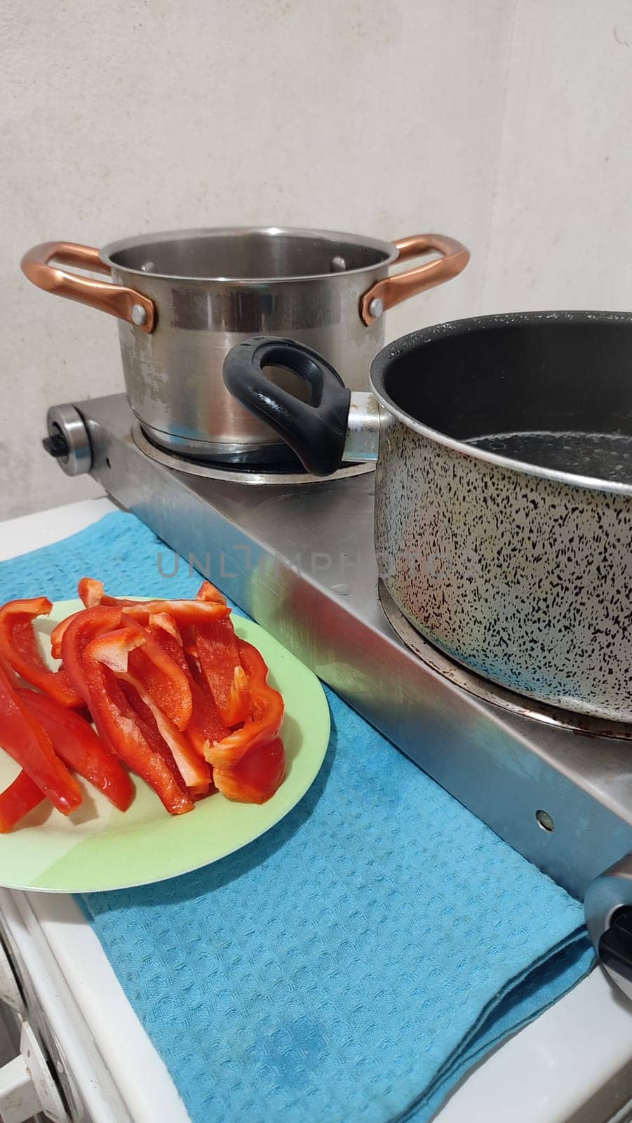 fresh cut red bell pepper, salad food pan in the kitchen vegetarianism. High quality photo