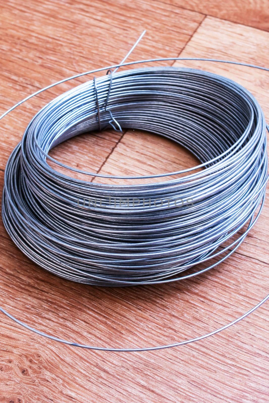 Large coil of wire on the table close up