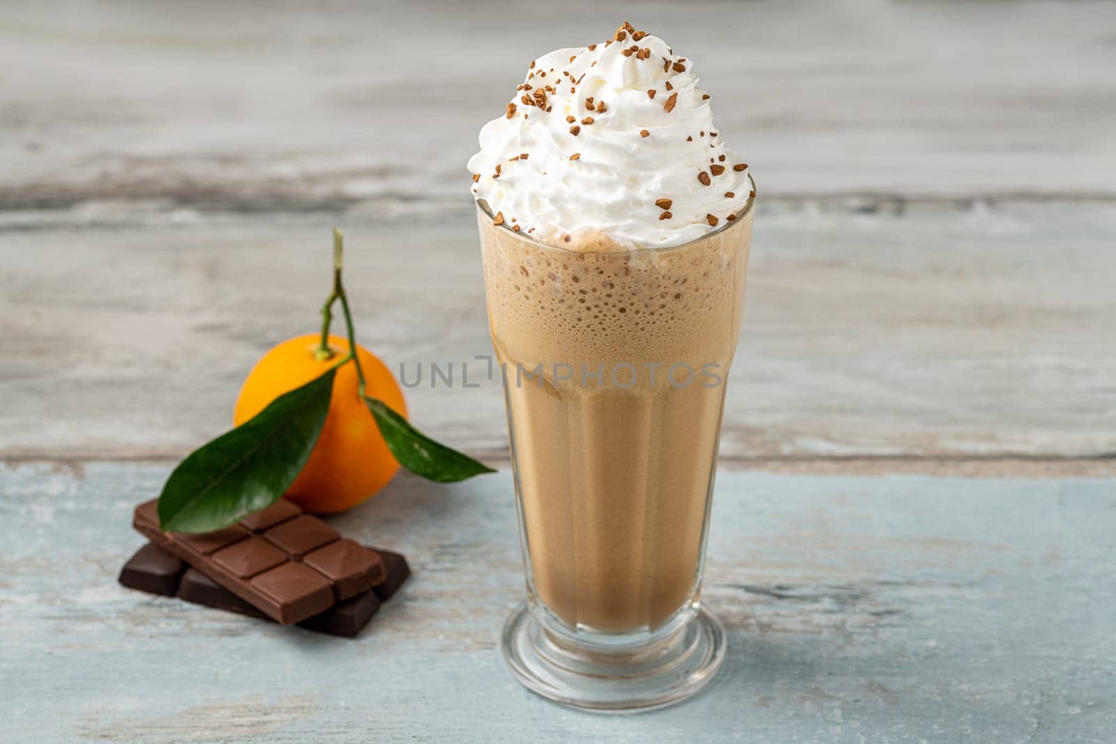 Orange and chocolate milkshake with coffee sprinkled on top