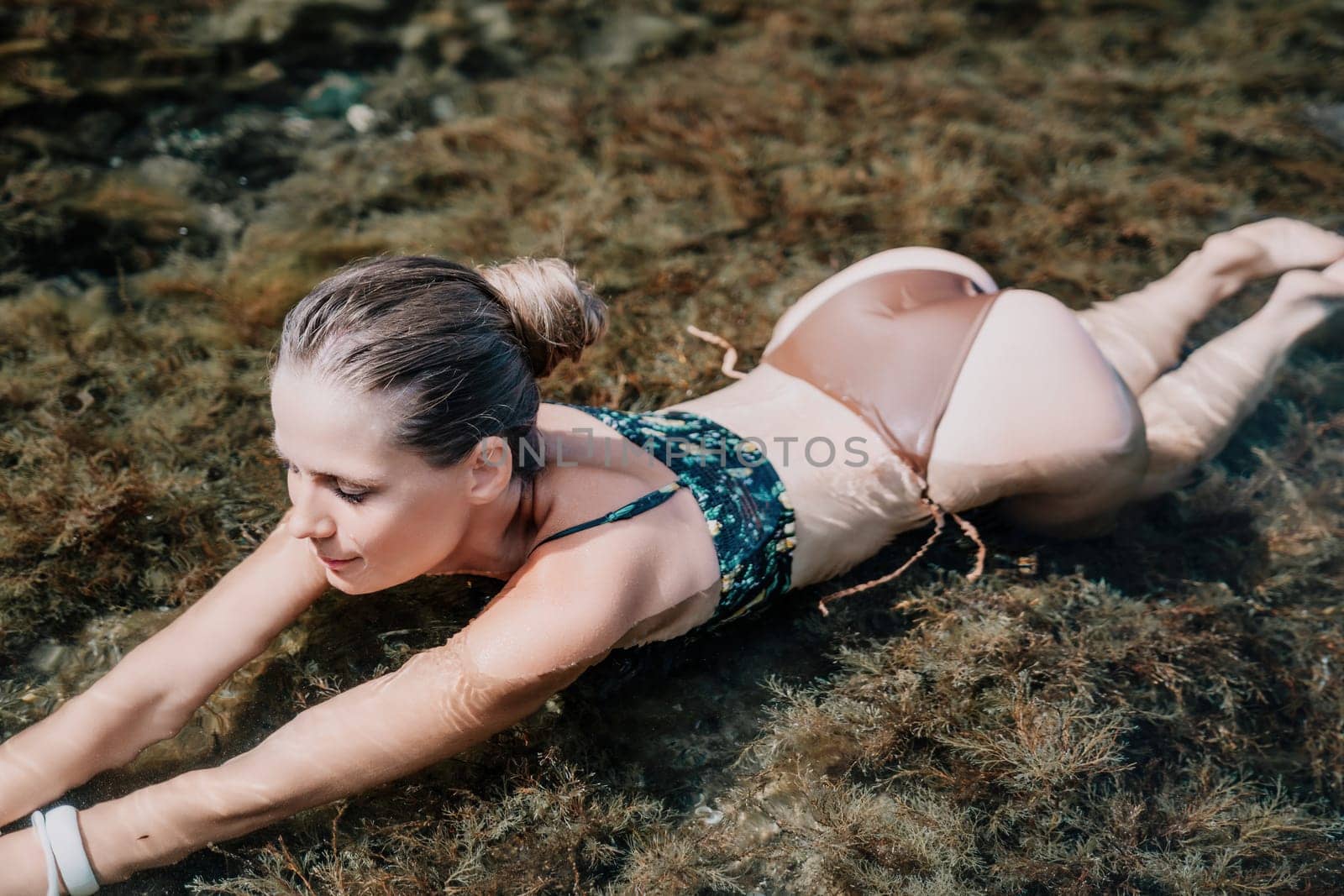 Woman travel sea. Happy tourist enjoy taking picture outdoors for memories. Woman traveler swim in the sea bay with mountains, sharing travel adventure journey by panophotograph