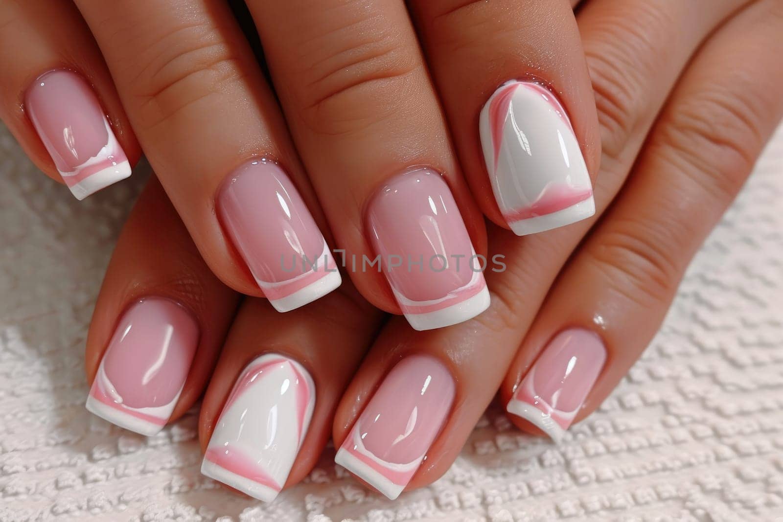 Close-up of delicate female manicure in pink tones by Yurich32