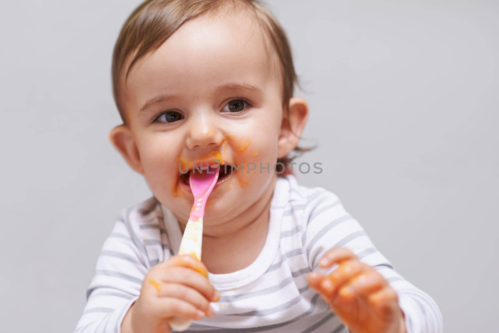 Eating, cute and boy baby in chair with vegetable food for child development at home. Sweet, nutrition and hungry young kid or toddler enjoying healthy lunch, dinner or supper meal at house. by YuriArcurs