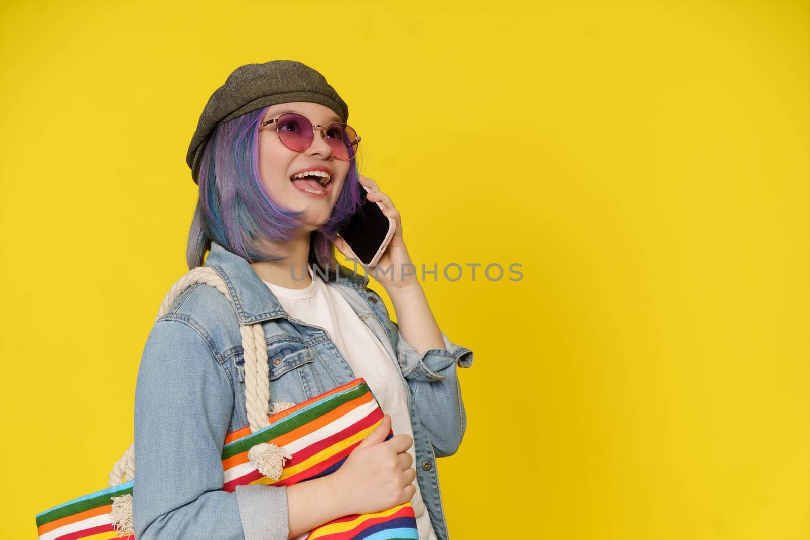 Intersection Of Technology, Shopping, And Cheerful Lifestyle. Asian Girl Has Phone Call, While Holds Shopping Bag On Shoulder Isolated On Yellow With Copy Space. . High quality photo