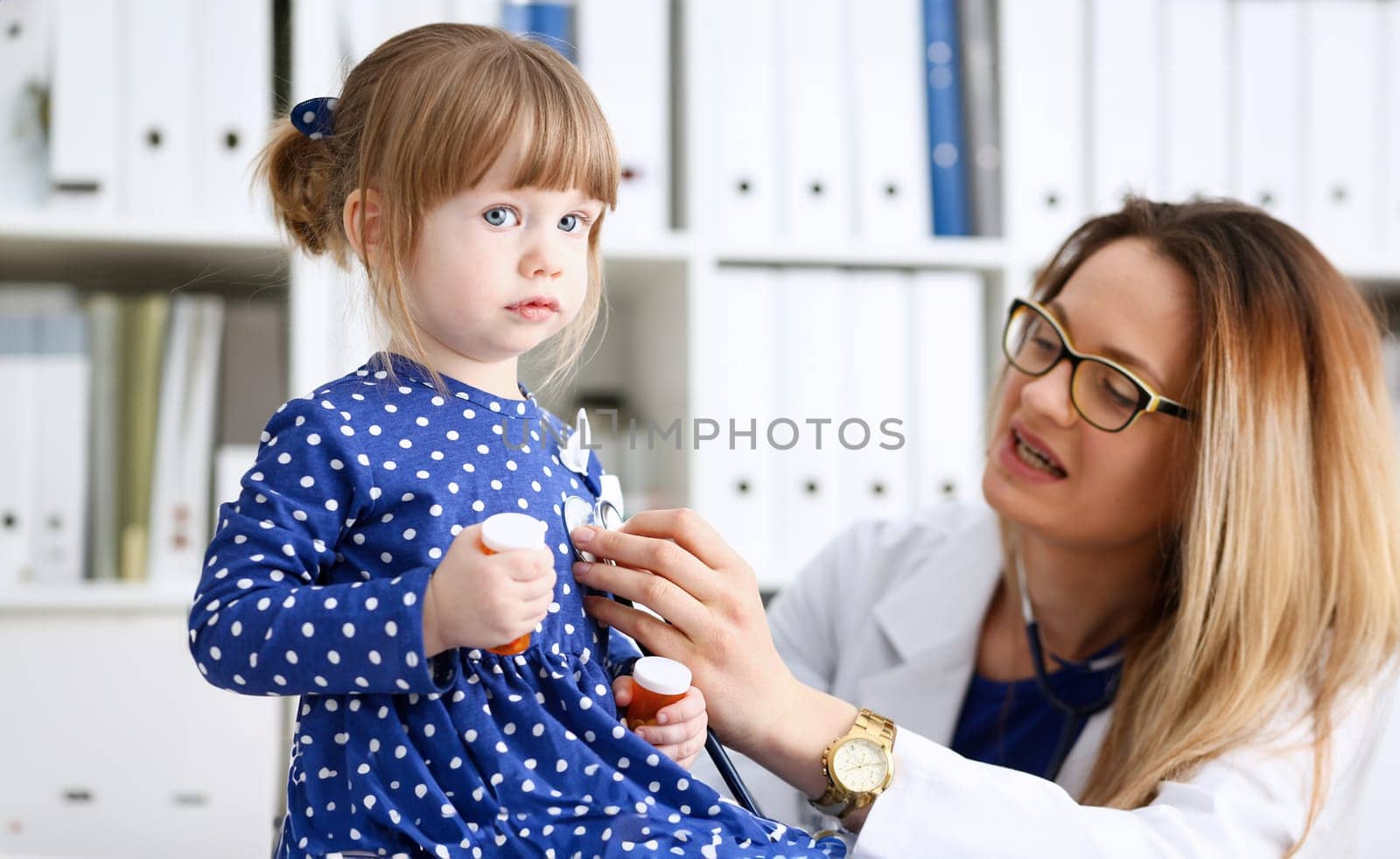 Little child with stethoscope at doctor reception. Physical exam cute infant portrait baby aid healthy lifestyle ward round child sickness specialist clinic test pulse concept