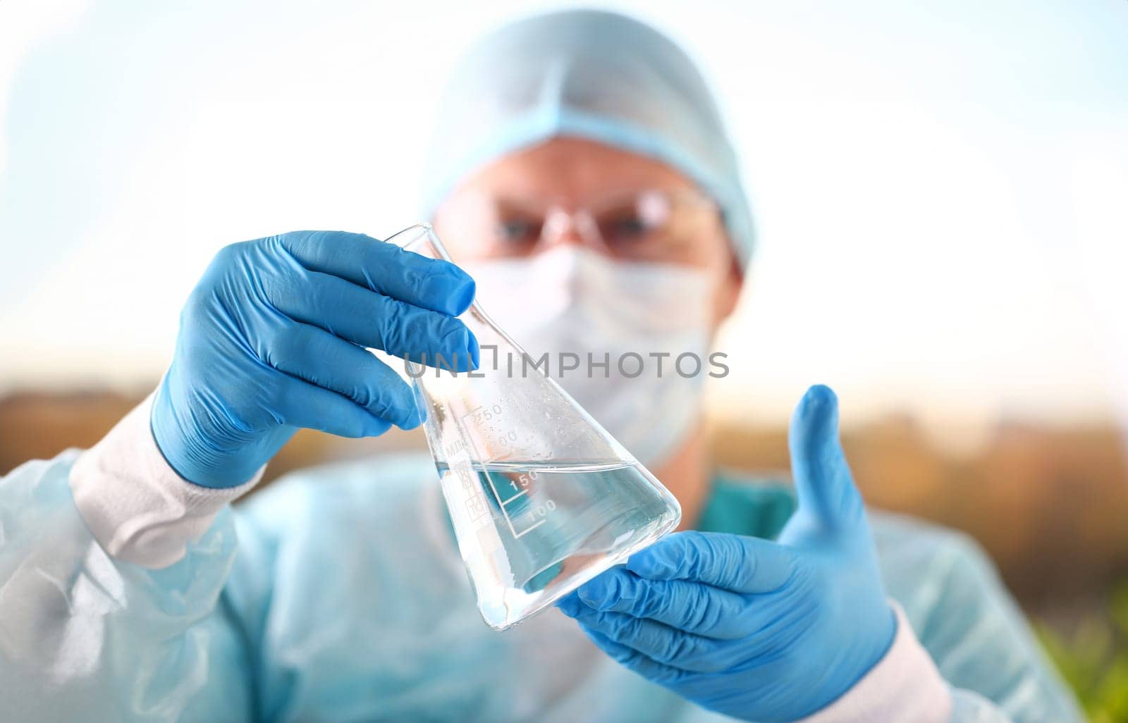 Male scientist hold in arm empty vials closeup. Chemical lab exam food additives medical blend concentrate acid measurement innovation drug toxic poison infection measure microbiology concept