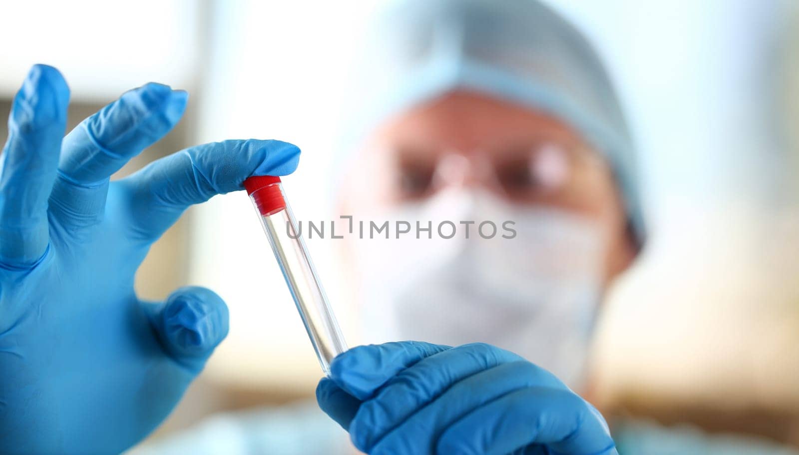 Male scientist hold in arm empty vials closeup by kuprevich