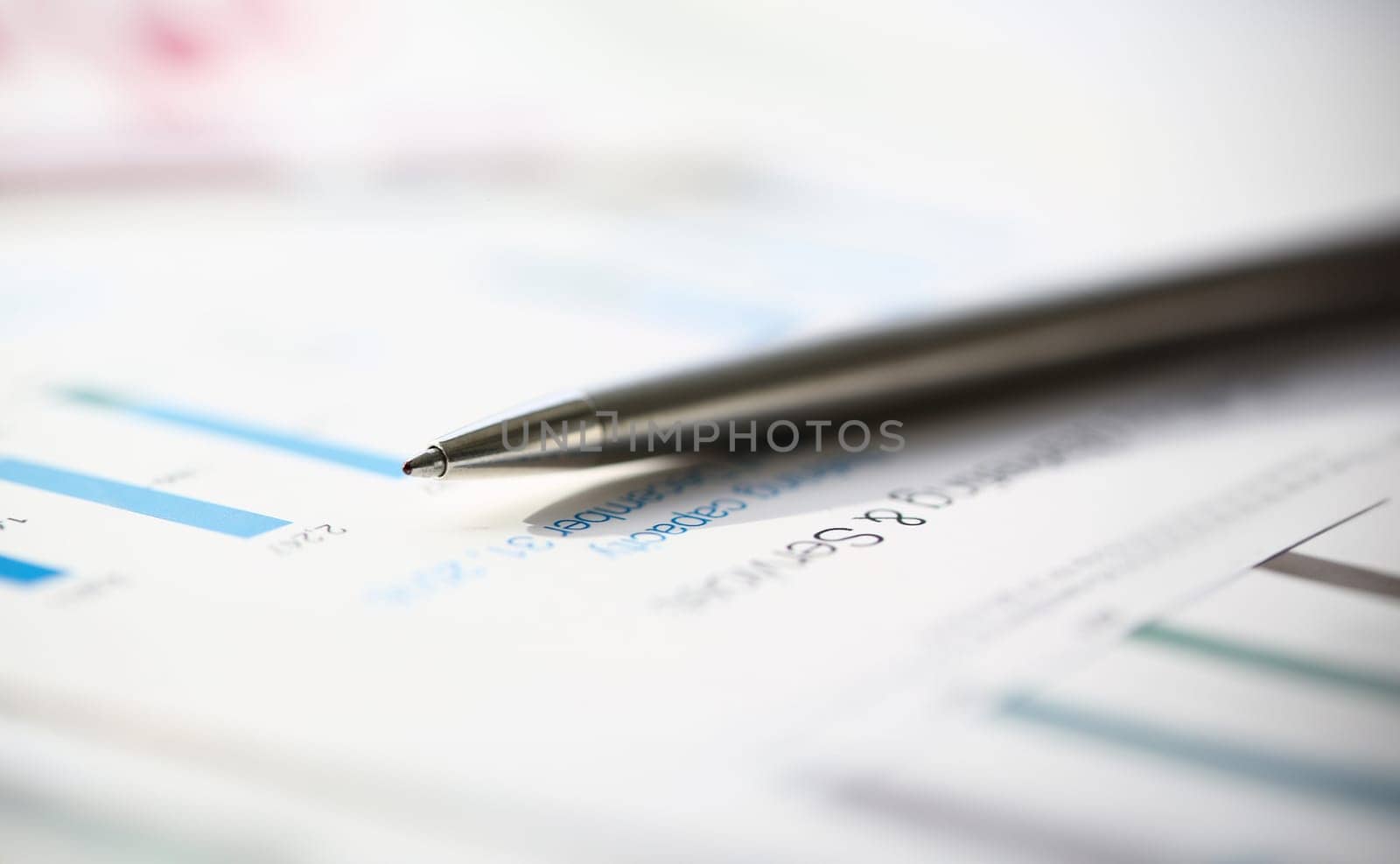 Financial statistics documents ball pen infographics at office table closeup. Internal Revenue Service inspector sum check, investigation, exchange market, earnings, savings, loan and credit concept