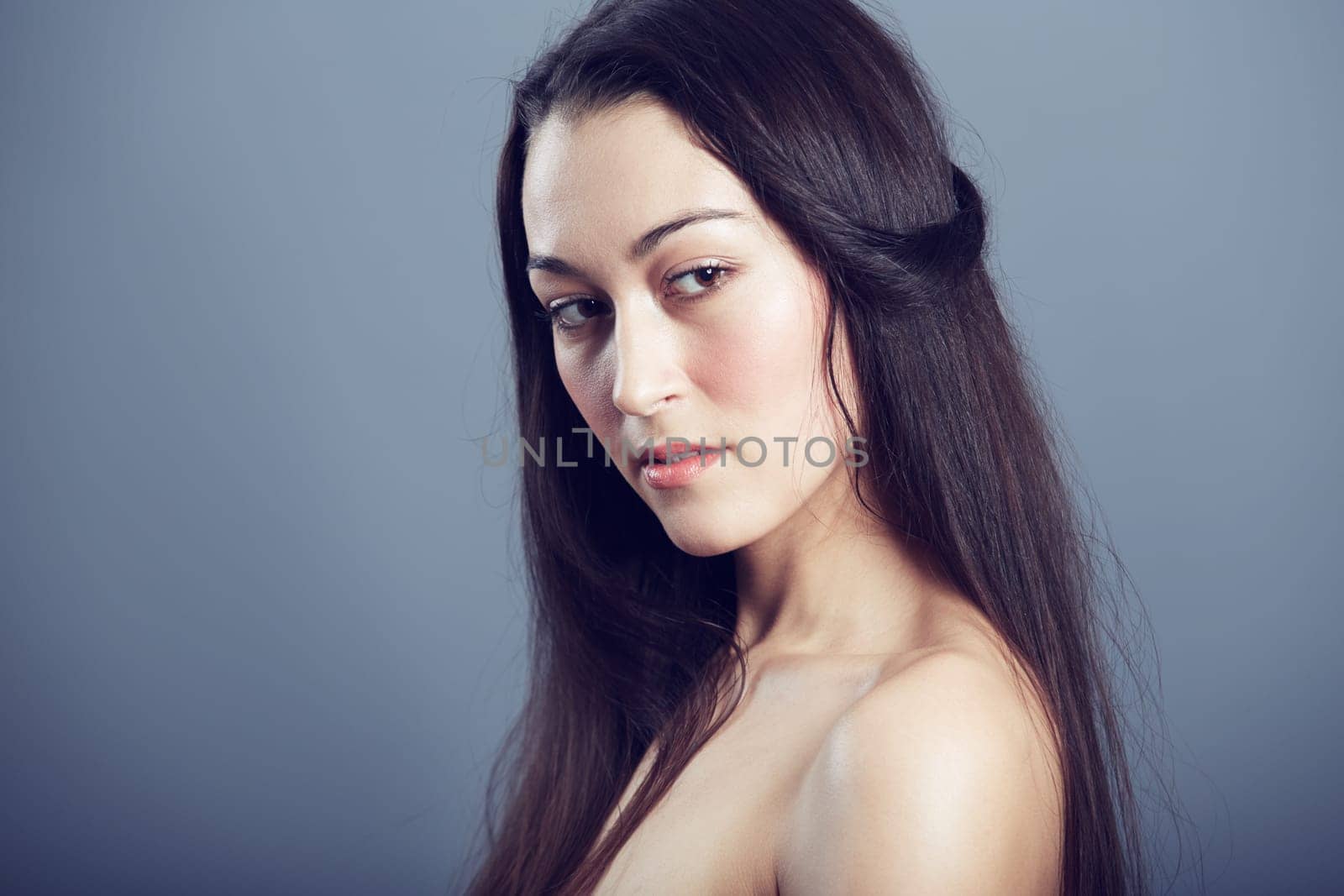 Natural beauty, cosmetic care and woman with hair in studio, hairstyle and shine on dark background. Portrait, makeup glow on skin with dermatology, haircare and texture with growth and shine by YuriArcurs