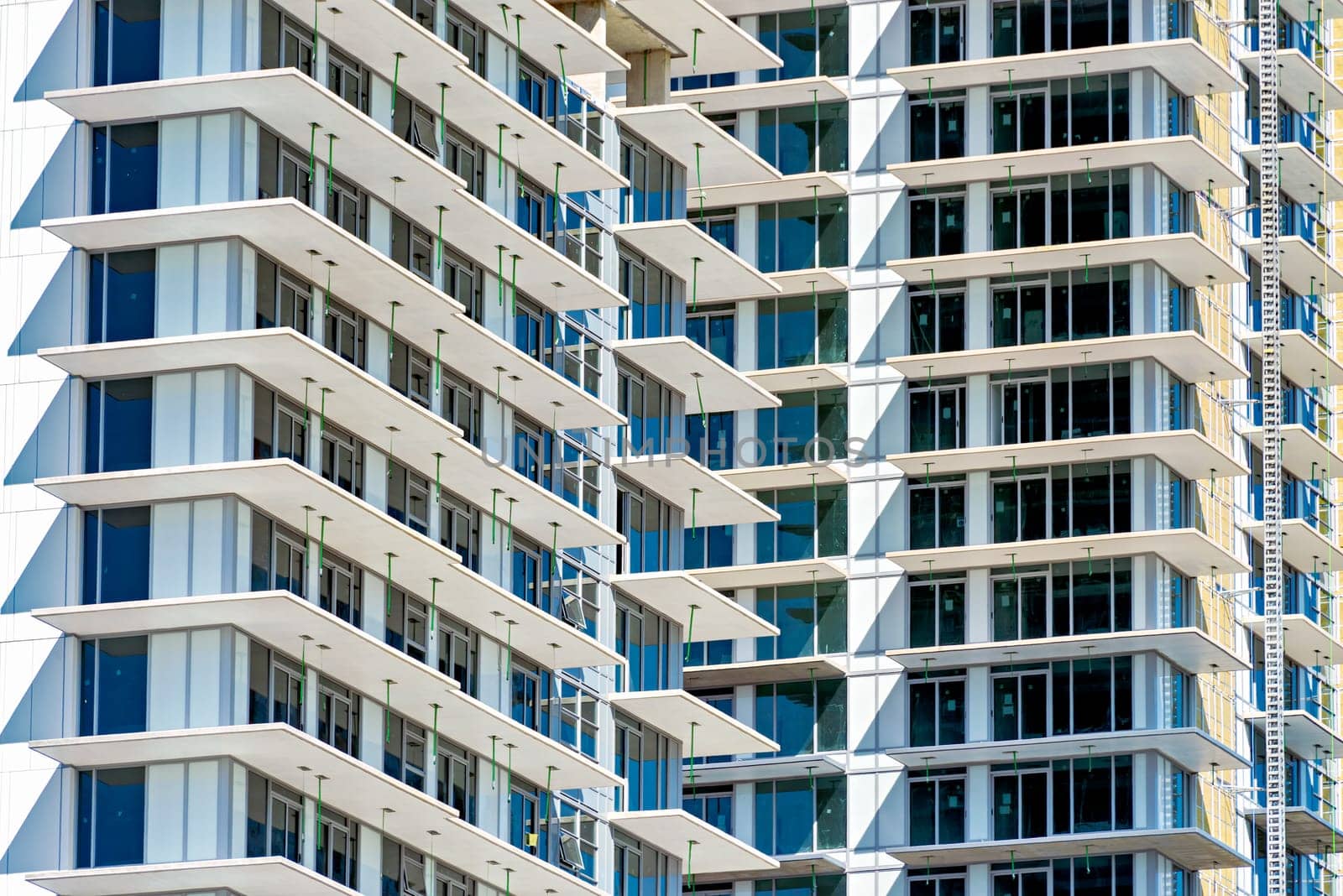 New highrise residential building under construction. Background image