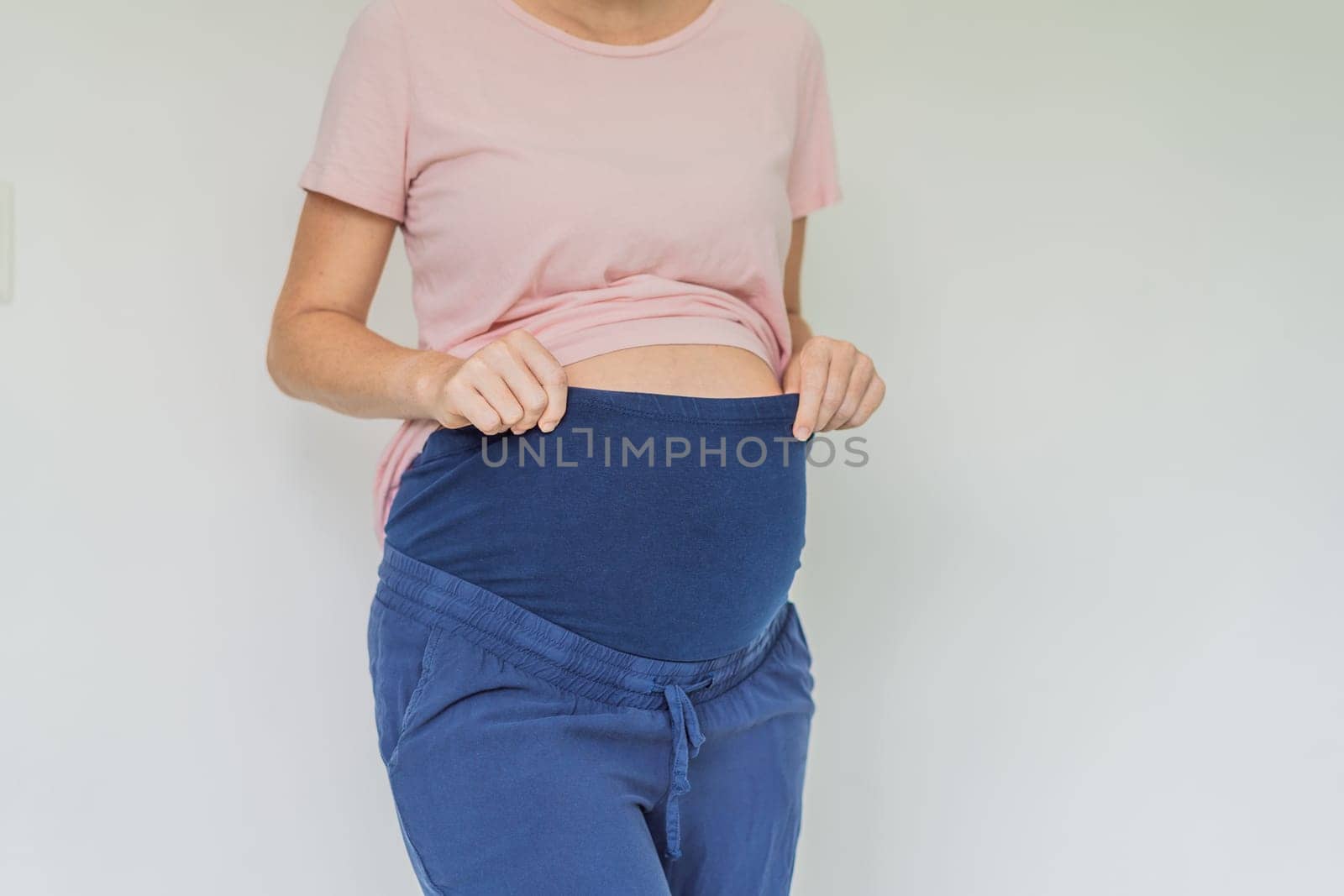 Chic maternity pants, comfy belly insert for expecting moms - stylish, practical, and perfect for the journey into motherhood.