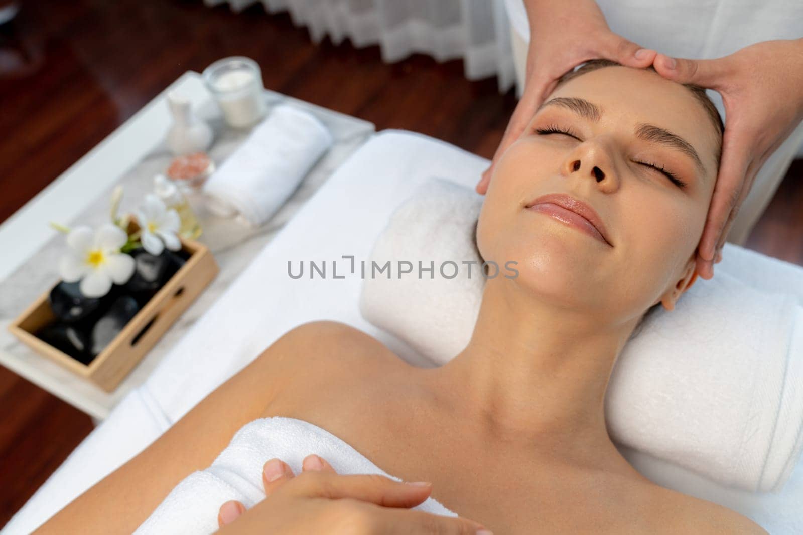 Caucasian woman enjoying relaxing anti-stress head massage. Quiescent by biancoblue