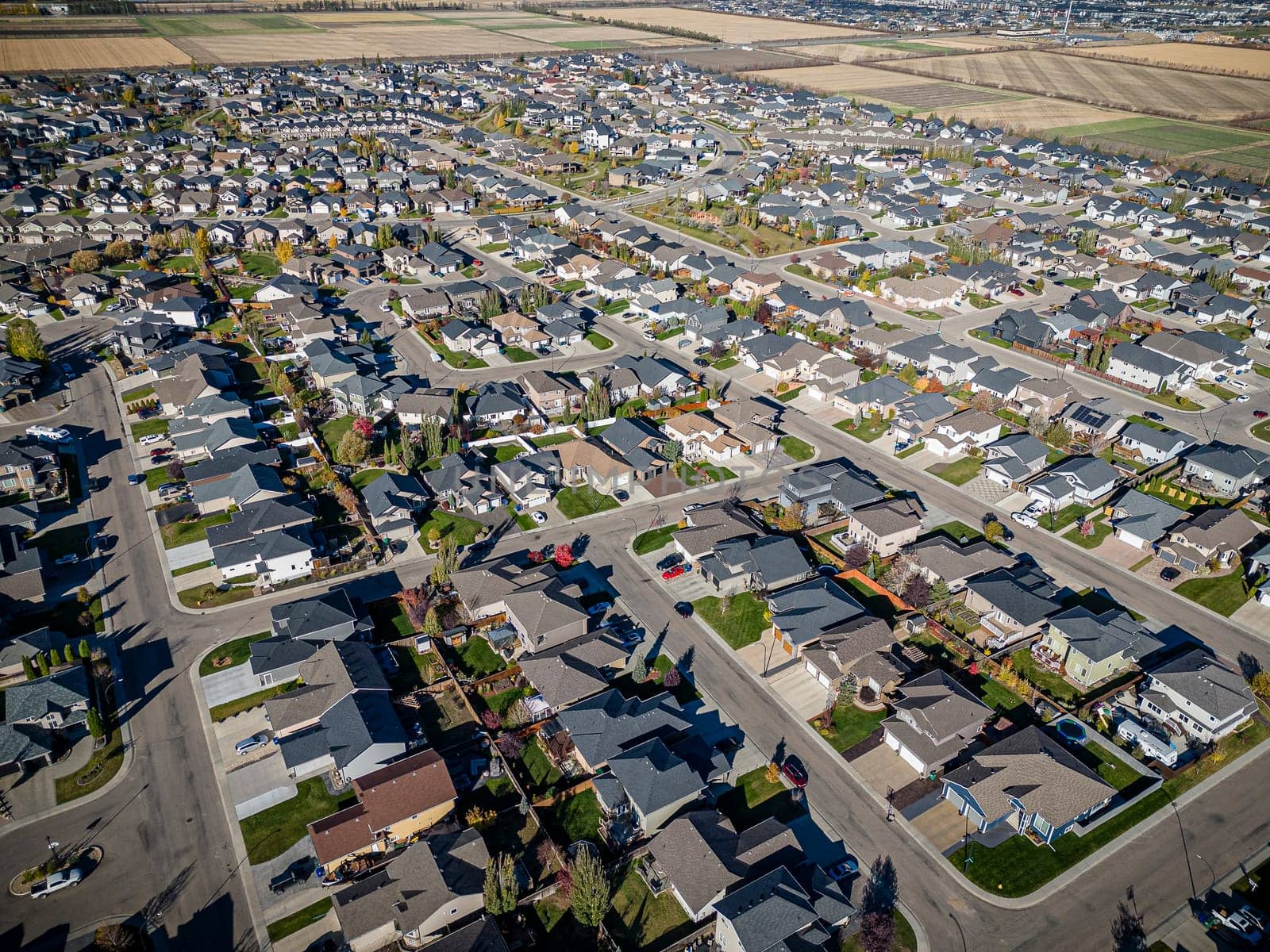 Drone shot over Willowgrove, Saskatoon, highlighting its residential beauty, modern streets, and vibrant community spaces.