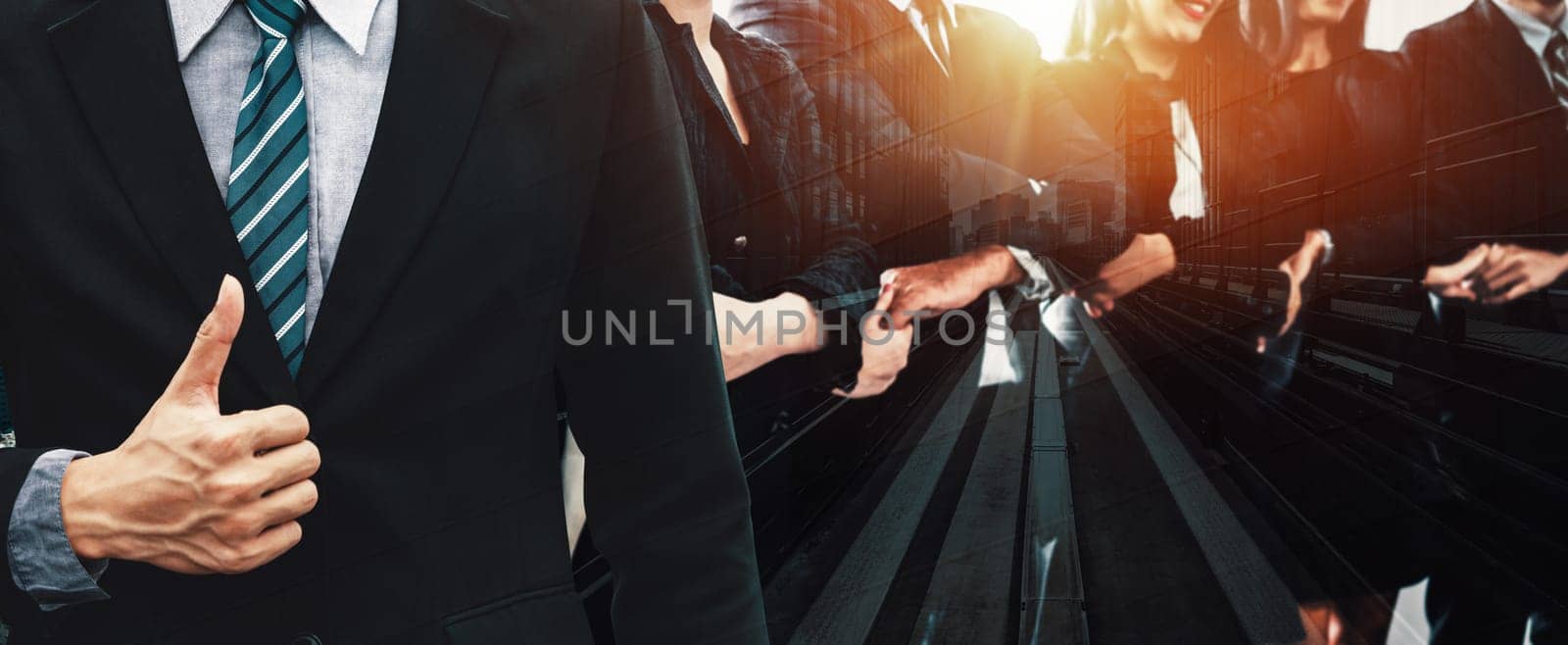 Business people group standing together with city office building background double exposure. Modern corporate job and human resources recruiting concept. uds