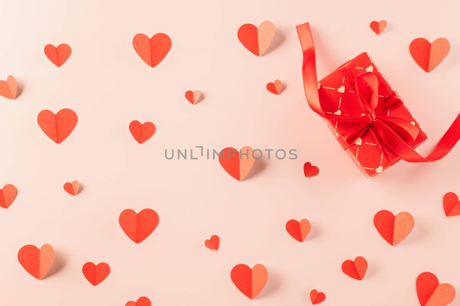 Happy Valentine's Day Background. Top view beautiful hearts and gift boxes on pastel pink background surprise your loved with space for text, mother's day, concept banner holiday