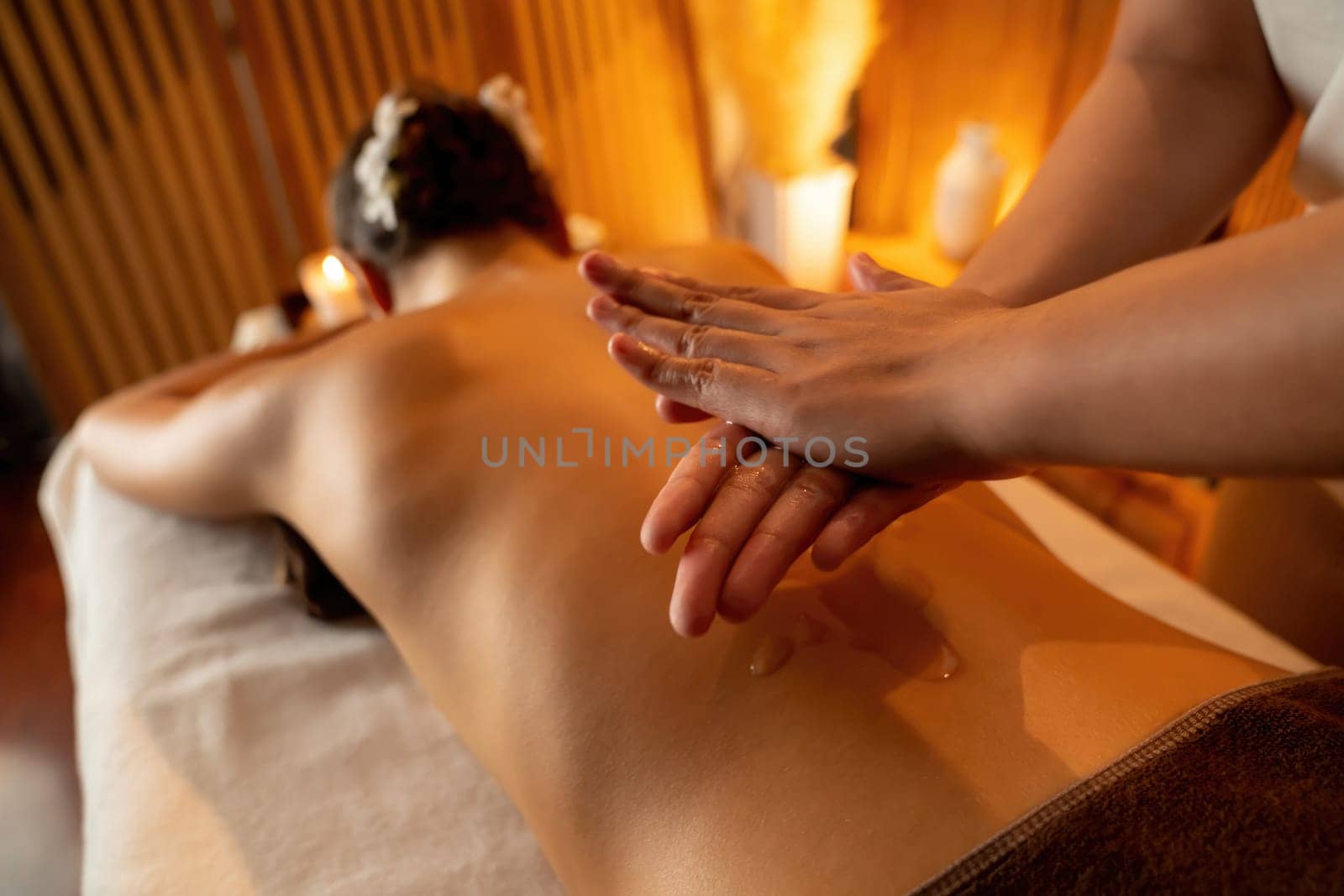 Masseuse prepare oil massage procedure for customer at spa. Quiescent by biancoblue