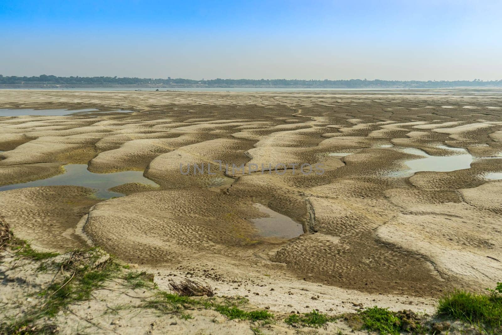 Embossed sandy texture. Sandbanks on the river bank