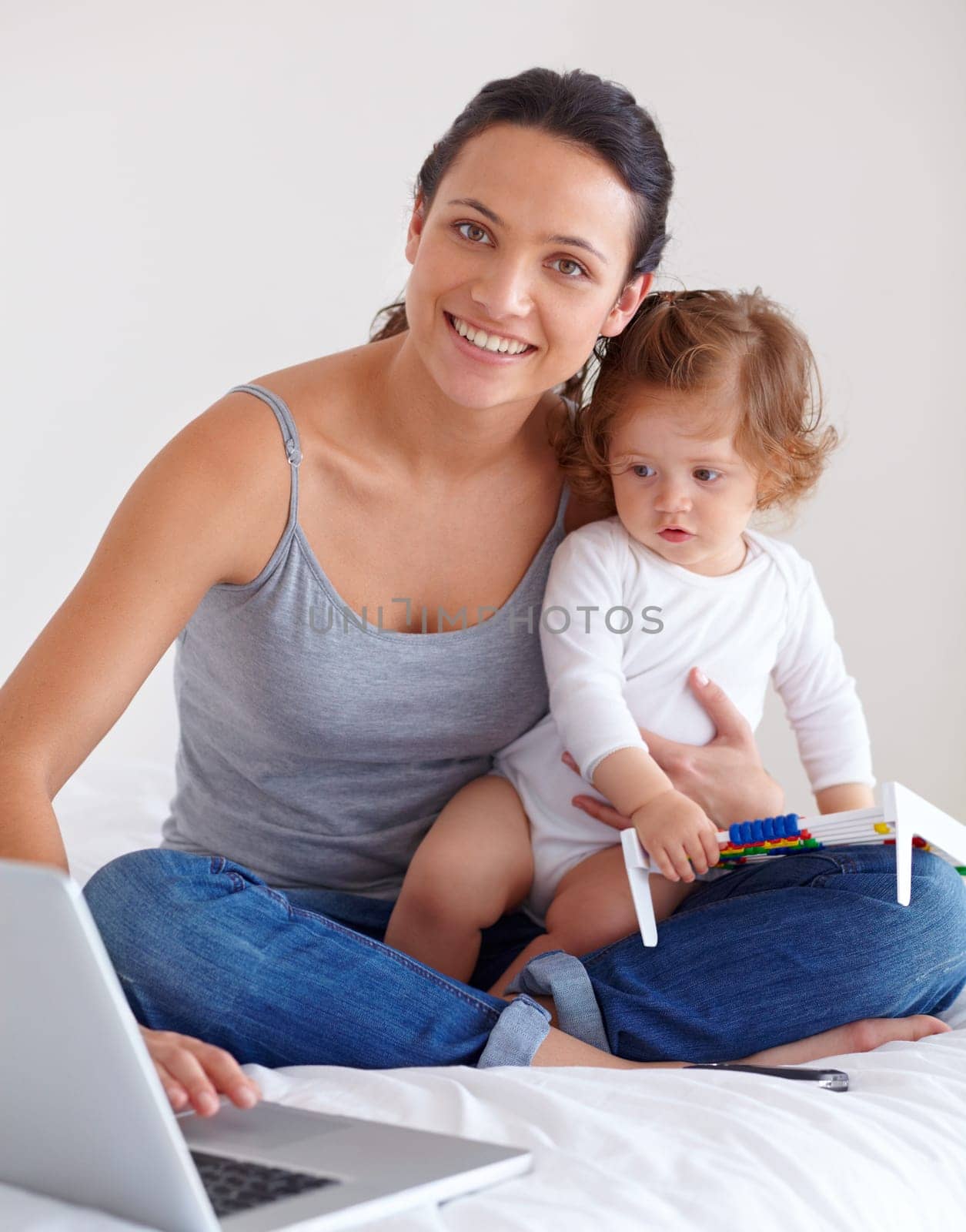 Portrait, baby and happy mother on laptop in bedroom for remote work, learning or education in home. Freelancer parent, computer and kid playing with abacus, care and toddler together with family.