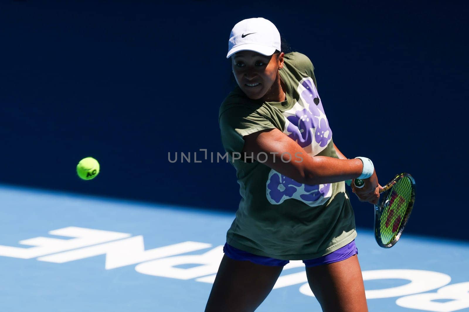 MELBOURNE, AUSTRALIA - JANUARY 12: Naomi Osaka of Japan practices with Ons Jabeur of Tunisia ahead of the 2024 Australian Open at Melbourne Park on January 12, 2024 in Melbourne, Australia.