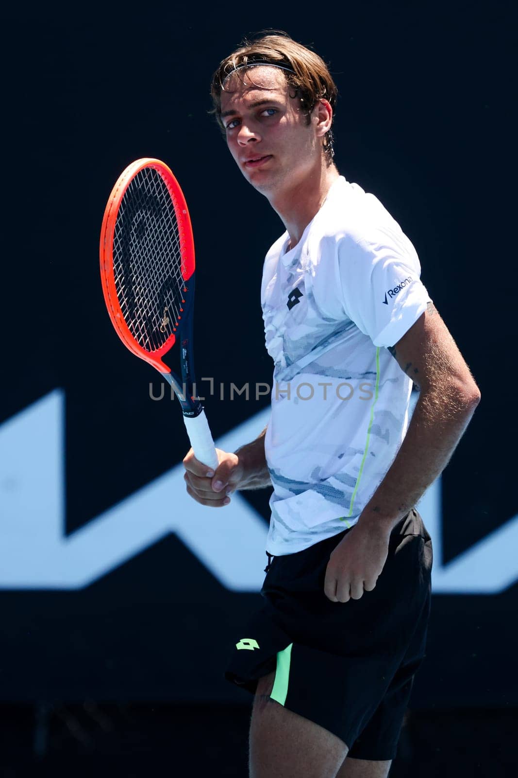 MELBOURNE, AUSTRALIA - JANUARY 12: Flavio Cobolli of Italy on his way to beating Santiago Fa Rodriguez Taverna of Argentina in qualifying Atmosphere ahead of the 2024 Australian Open at Melbourne Park on January 12, 2024 in Melbourne, Australia.