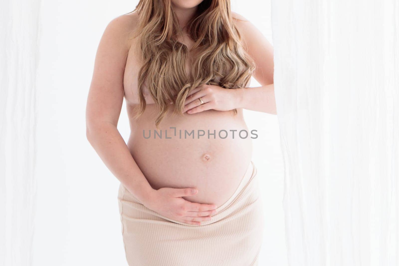 Beautiful young pregnant woman on white background banner
