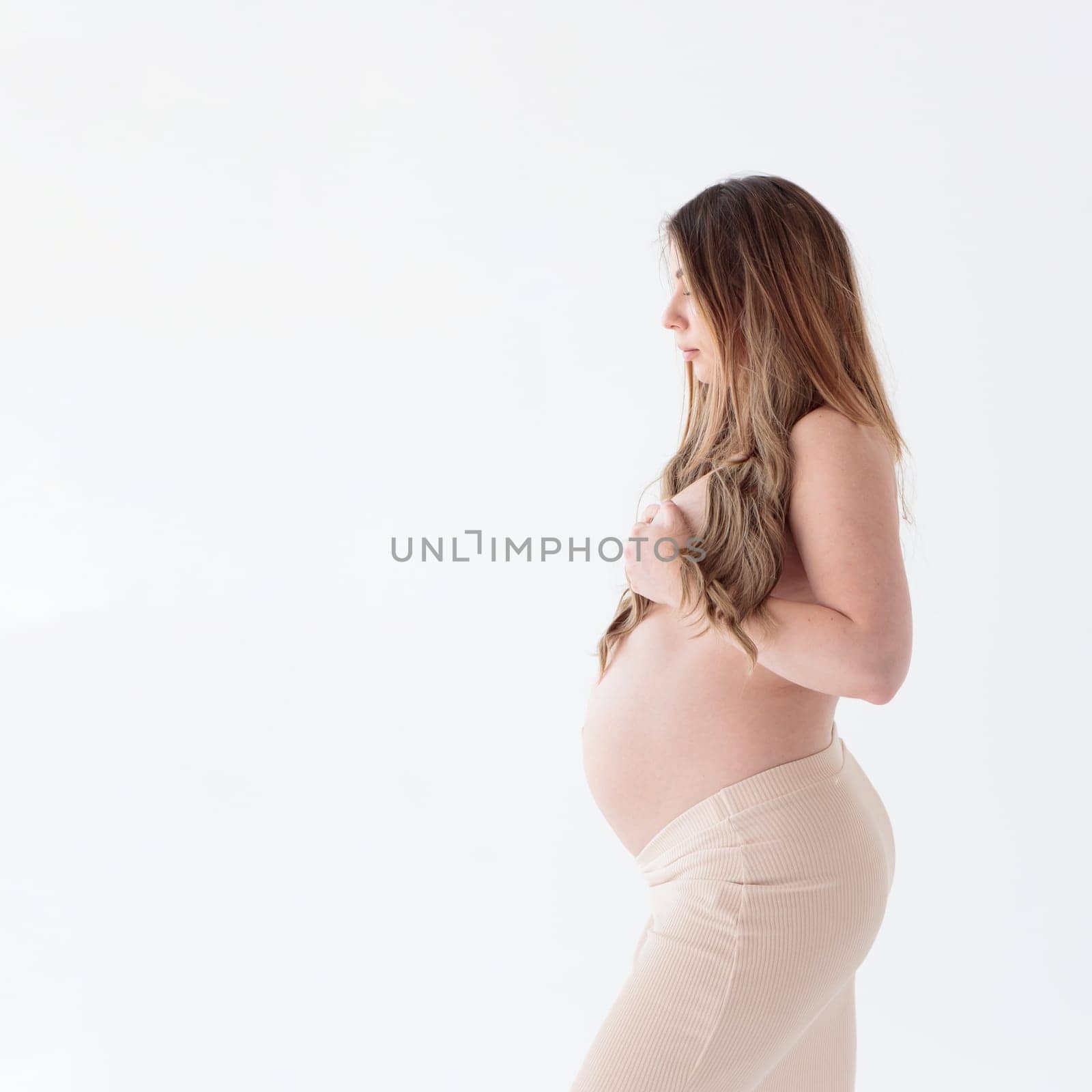 Beautiful young pregnant woman on white background banner