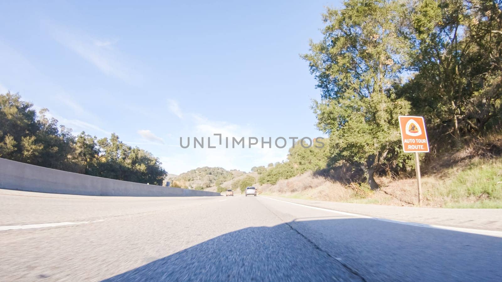 Basking in the beauty of a sunny winter day, driving on HWY 1 near Las Cruces, California offers stunning views of the picturesque coastal landscape against a backdrop of clear blue skies.