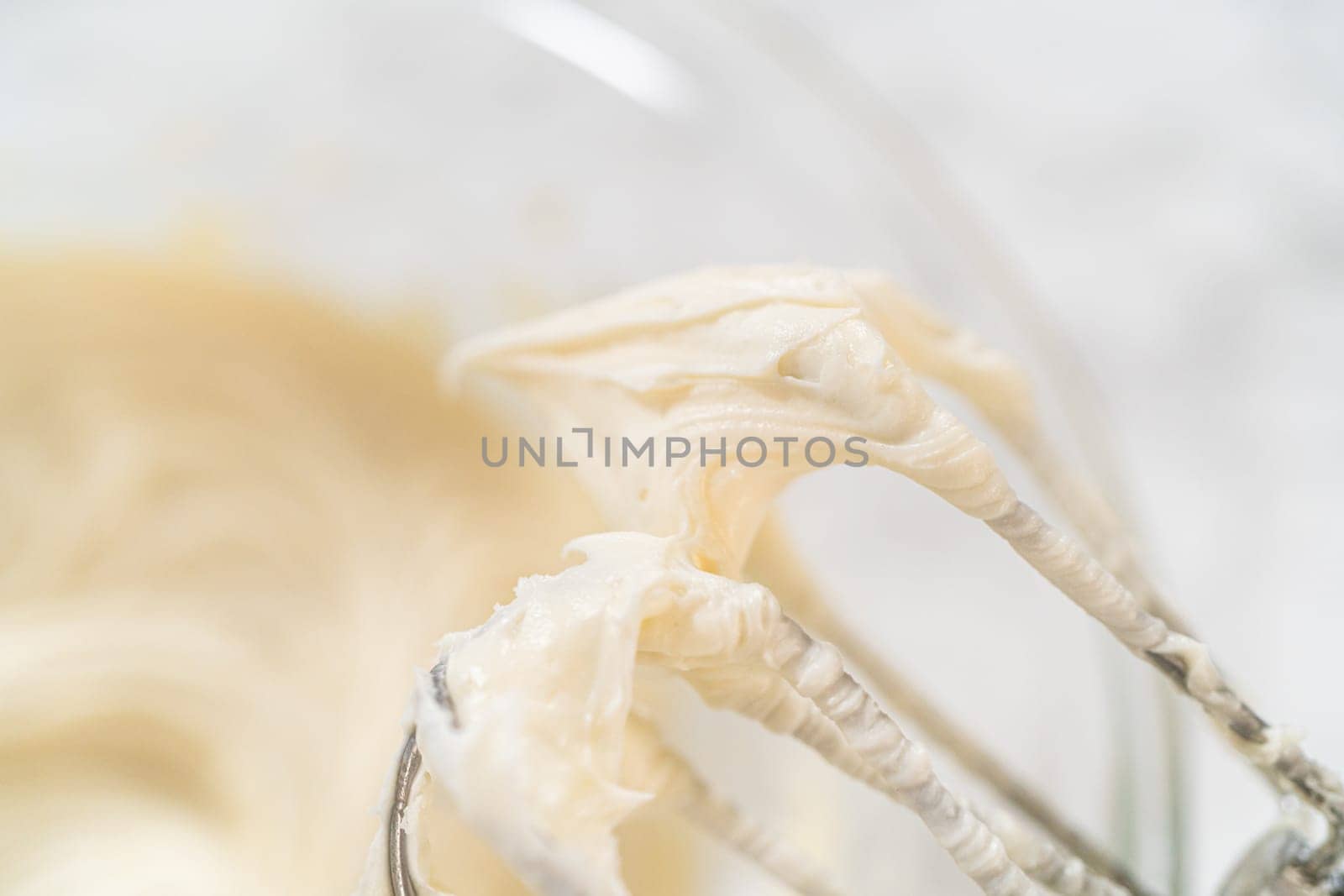 Creating a delectable treat, the process of making homemade cream cheese frosting involves whisking together creamy ingredients to achieve the perfect texture and taste.