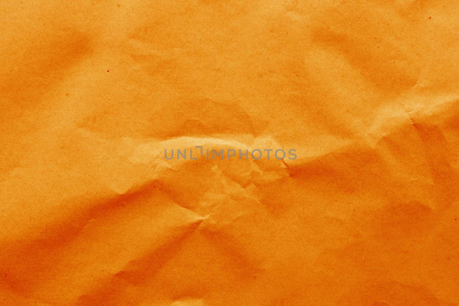 Cardboard background from natural crumpled paper in orange color.....
