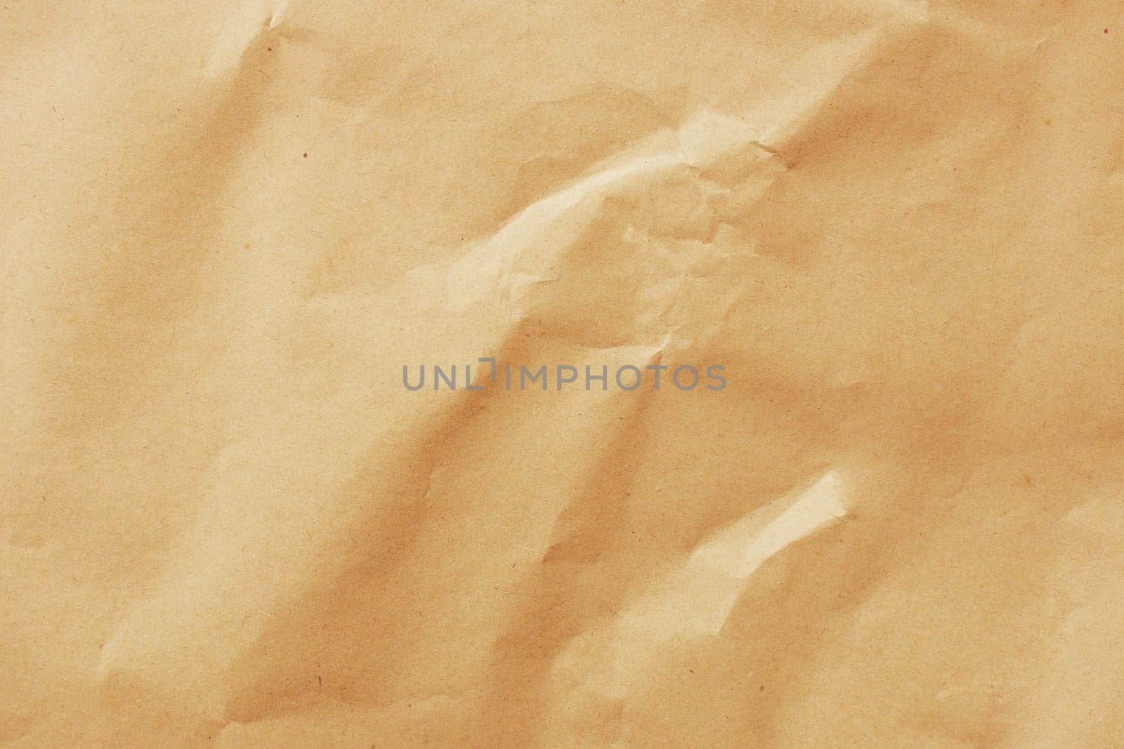 Cardboard background from natural crumpled brown paper