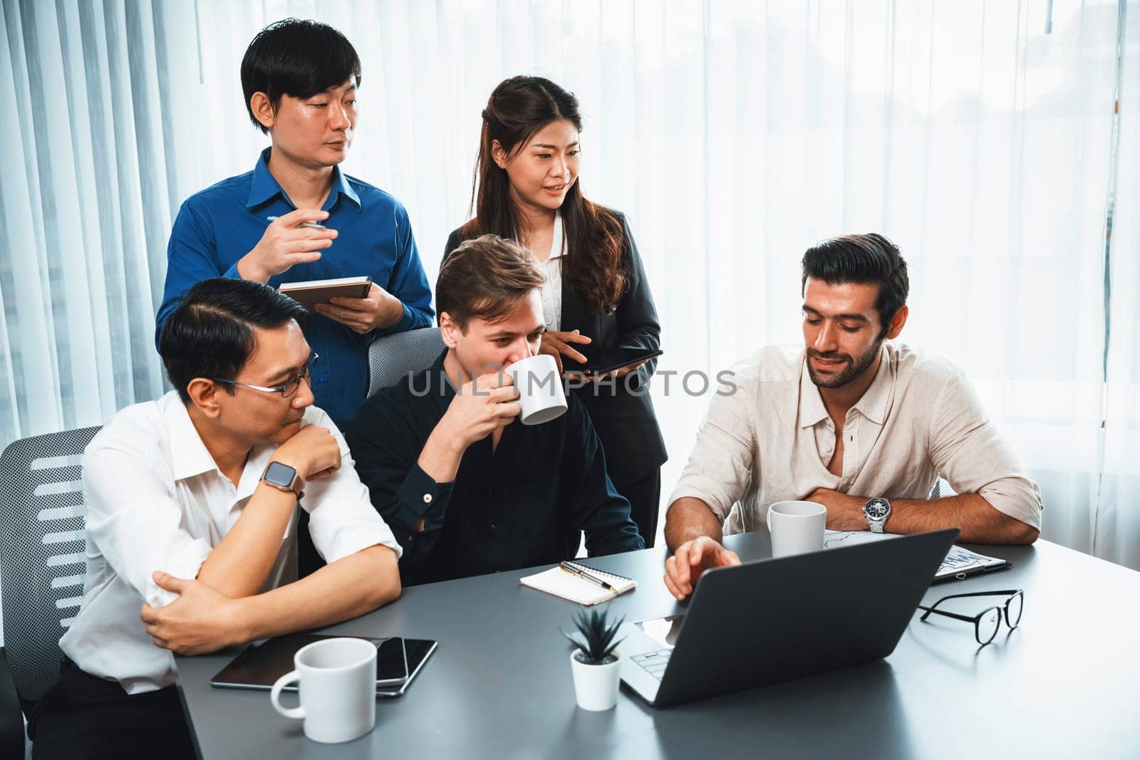 Group of diverse office worker employee working together on strategic business marketing planning in corporate office room. Positive teamwork in business workplace concept. Prudent