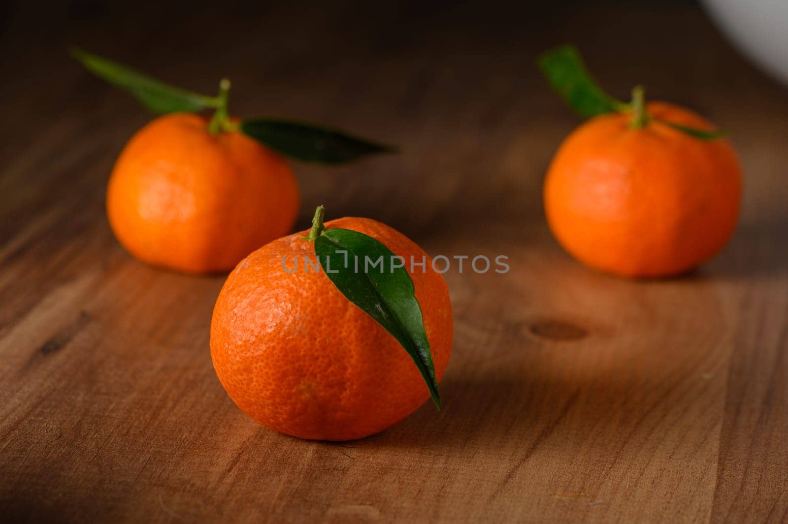 fresh juicy three tangerines on a wooden table 13 by Mixa74