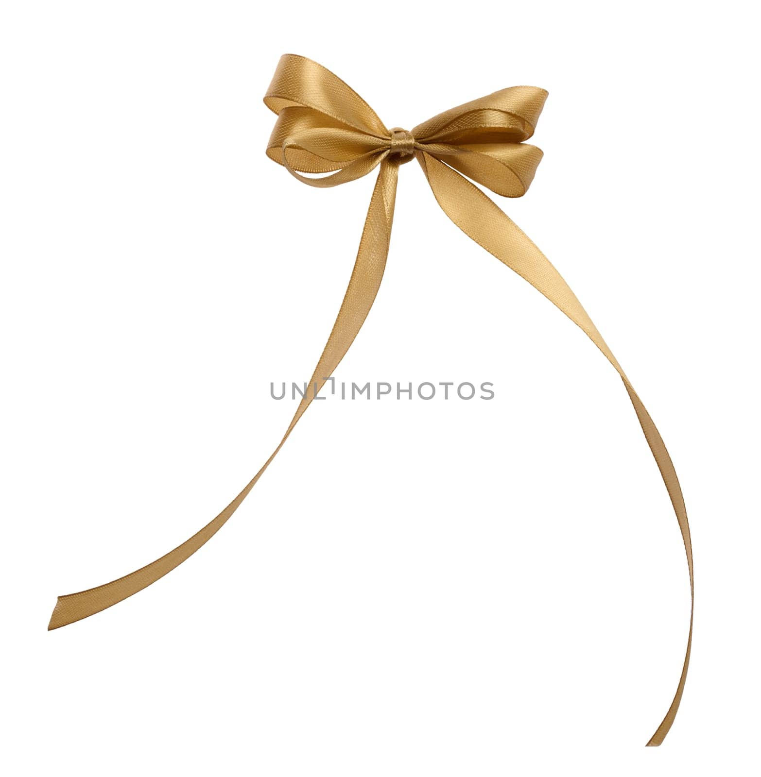 Tied bow made of golden silk ribbon on an isolated background, decor for a gift by ndanko