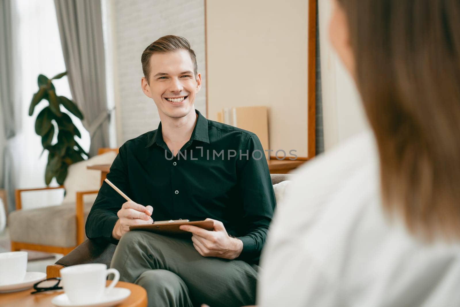Psychological consultation gaining improvement on mental problem, happy young female patient doing therapy session while psychiatrist making diagnostic on mental illness. Unveiling
