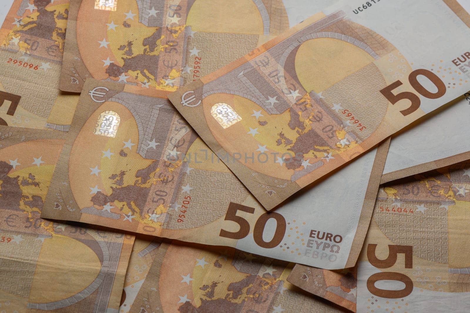 50 euro bills scattered on the table as a background