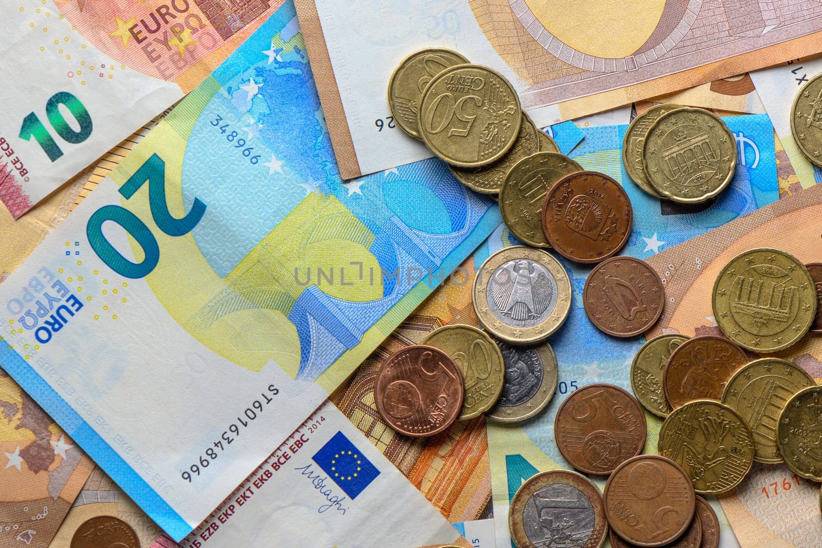 Euro bills and coins scattered on the table as a background 3