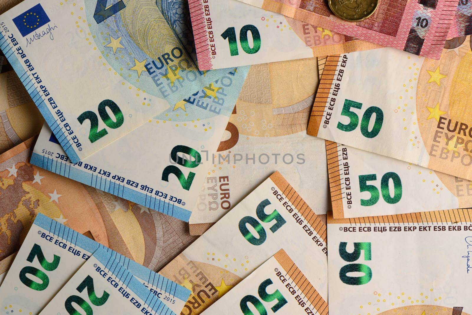 euro bills scattered on the table as a background 2