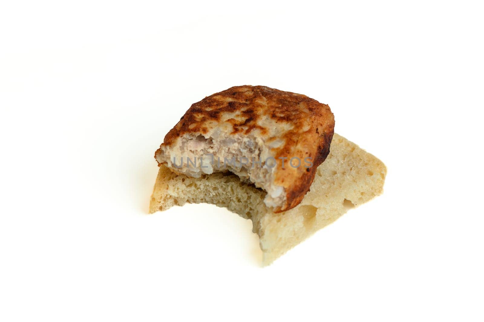 fish cutlet on a piece of bread, bitten off