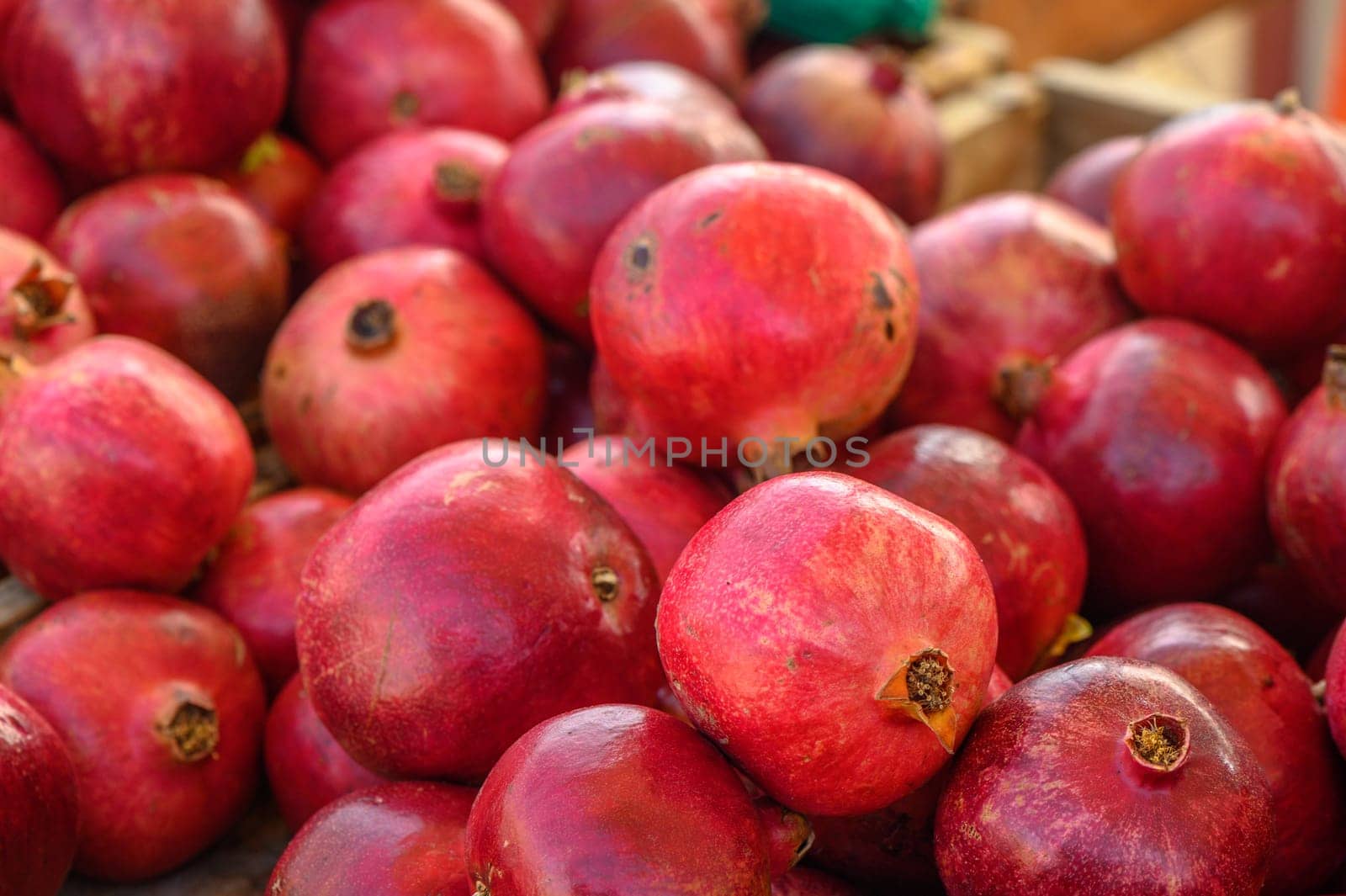 fresh juicy pomegranates at the bazaar on the island of Cyprus in autumn 2 by Mixa74